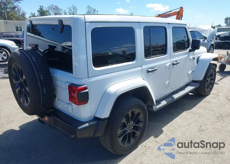 2022 Jeep Wrangler 4Xe Unlimited Sahara 4X4 z USA, uszkodzony, nr VIN 1C4JJXP69NW261068